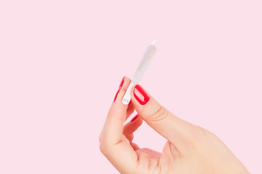 woman holding a joint