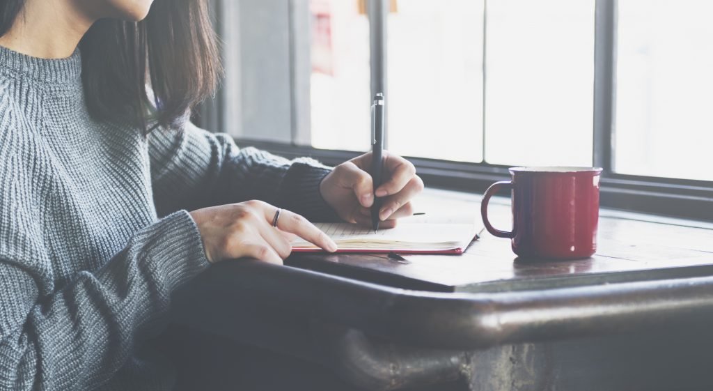 Lady Writing Notebook