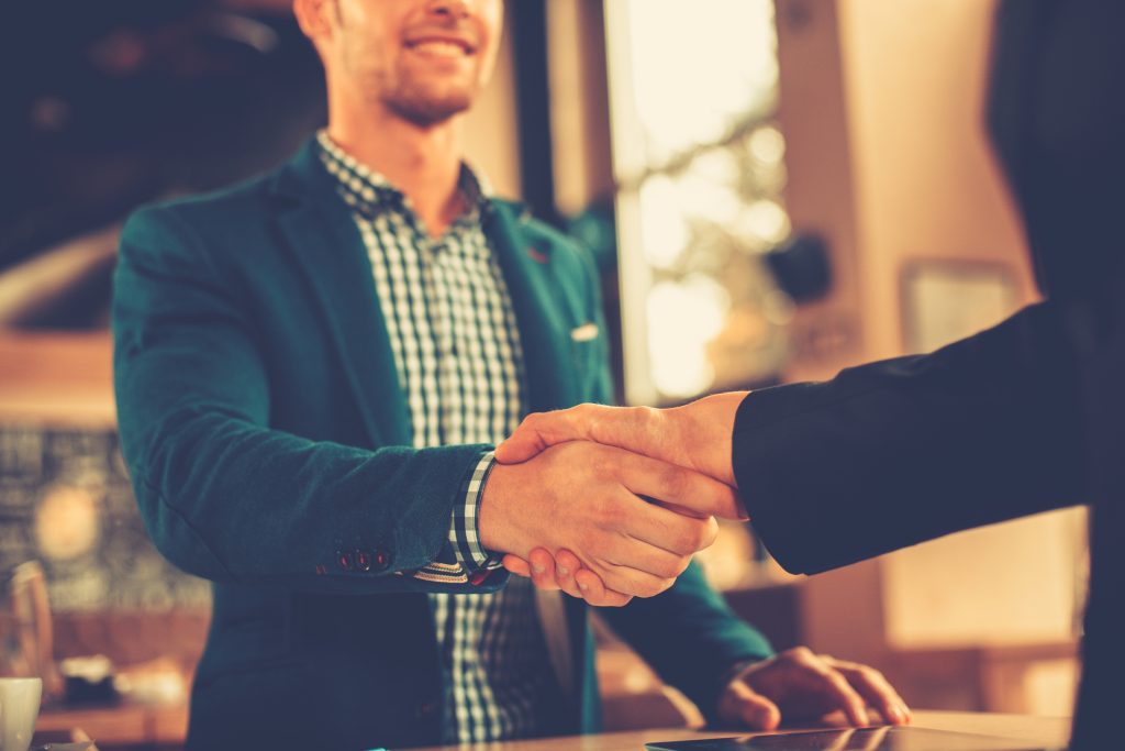 Men shaking hands after job interview